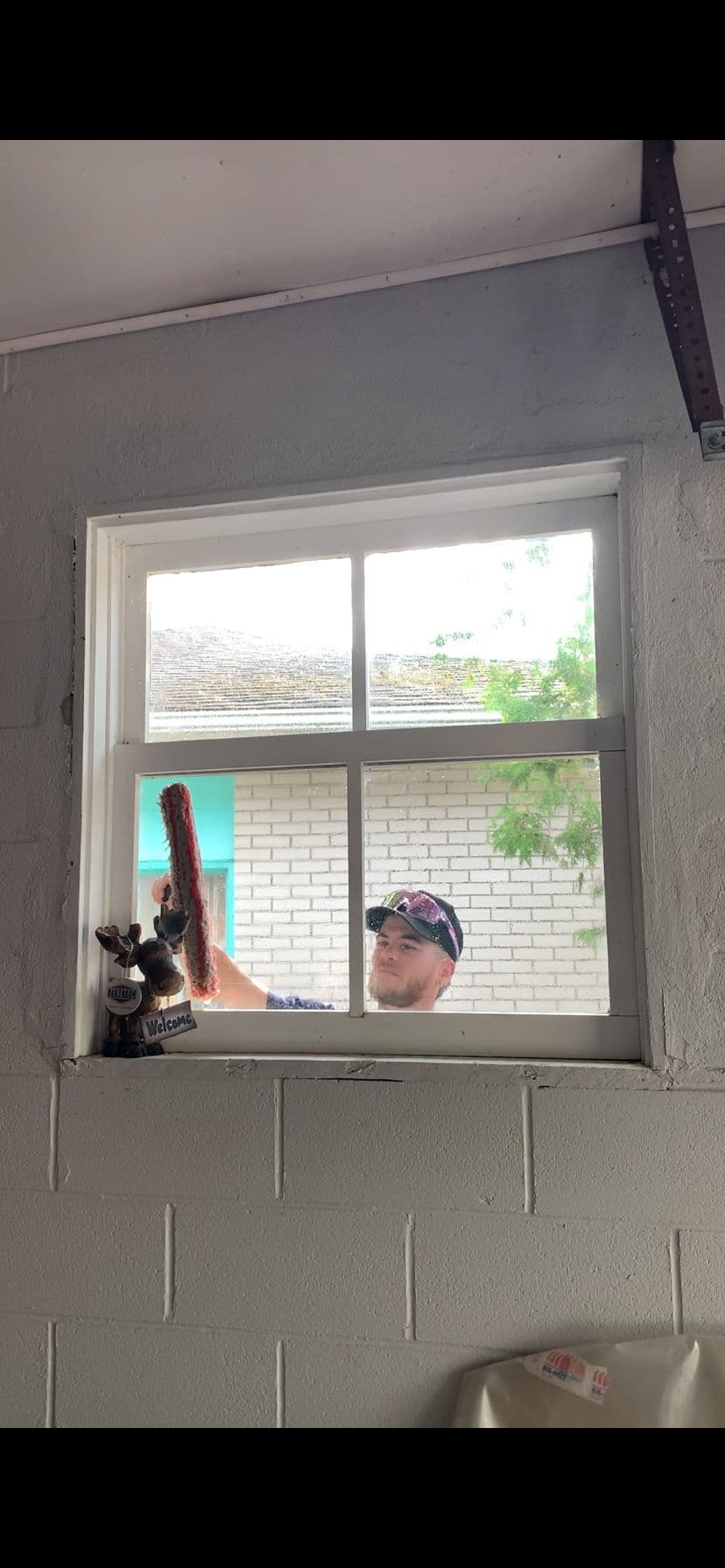 Devin from Home Service Hunks cleaning windows