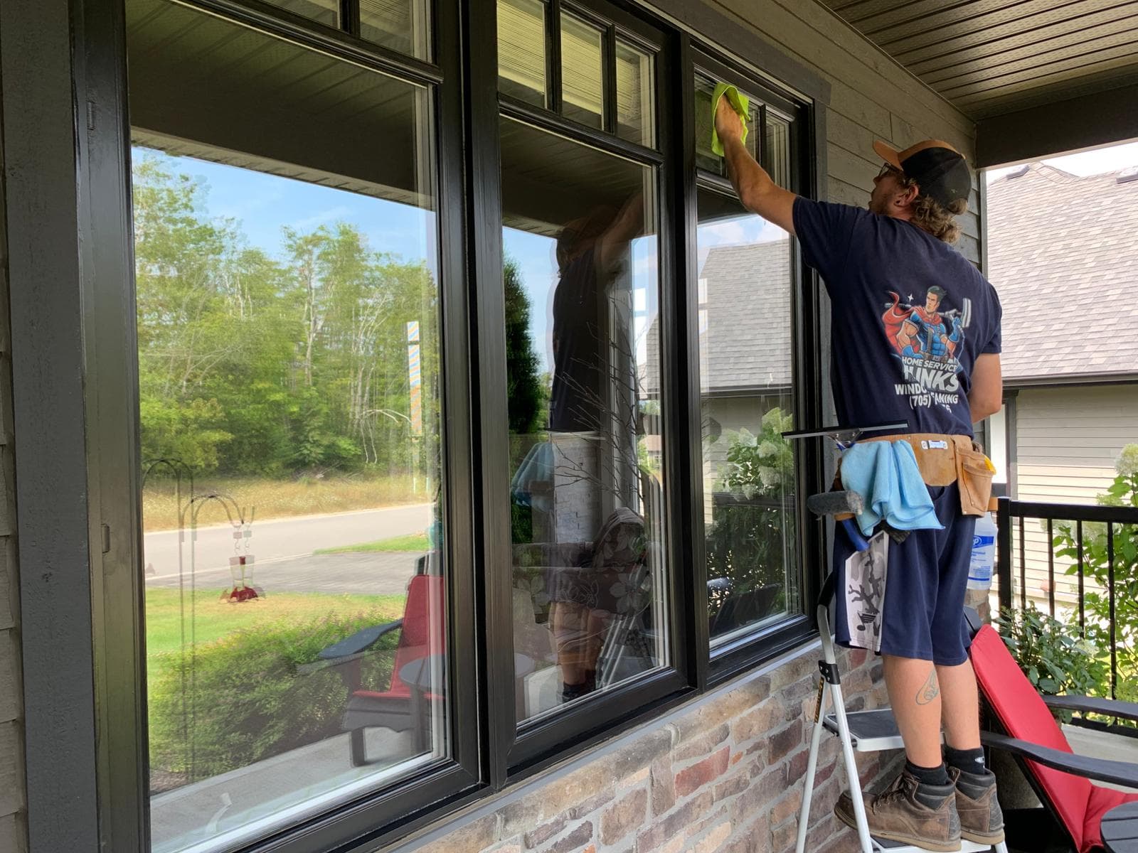 Chris from Home Service Hunks cleaning windows in Barrie