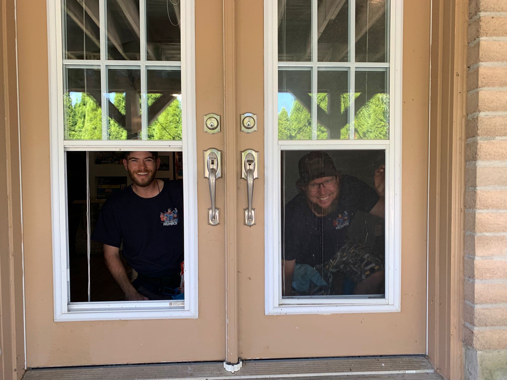 Devin and Chris cleaning windows together